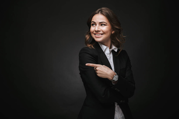Confident young businesswoman wearing a suit standing - Fotografie, Obrázek
