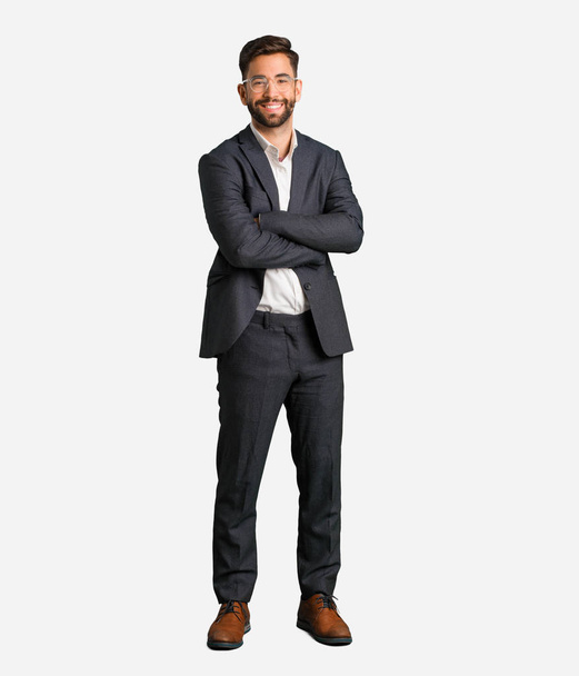 Young handsome business man crossing arms, smiling and relaxed - Foto, Imagem