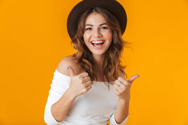 Portrait of a cheerful young woman wearing white shirt - Valokuva, kuva