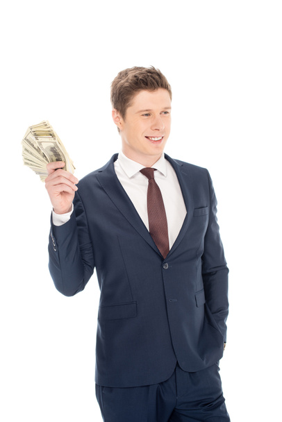 handsome businessman holding dollar banknotes isolated on white - Φωτογραφία, εικόνα