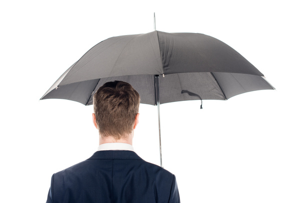 vista posterior del hombre de negocios con paraguas aislado en blanco
 - Foto, imagen
