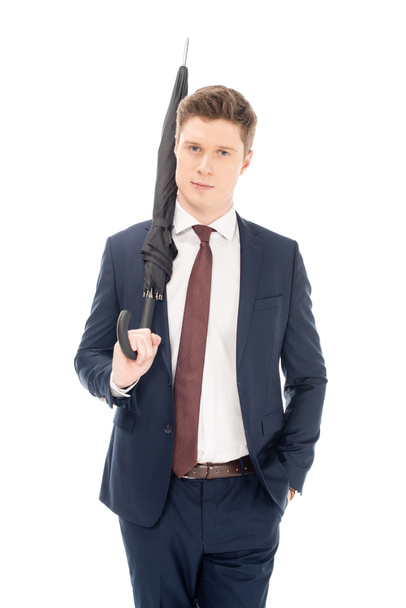 handsome businessman posing with umbrella isolated on white - Fotoğraf, Görsel