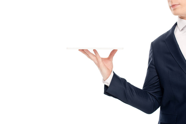 обрізаний вид молодого бізнесмена, що тримає цифровий планшет ізольований на білому
 - Фото, зображення