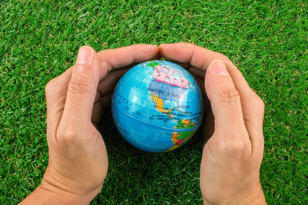 Plastic World Globe and Hands. - Photo, Image