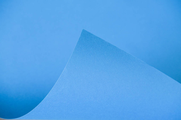 Abstraction of a design blue paper. Empty space on monochrome paper.  - Fotoğraf, Görsel