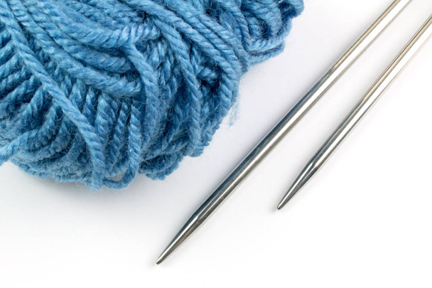 blue yarn and knitting needles isolated on white background - Foto, Imagen