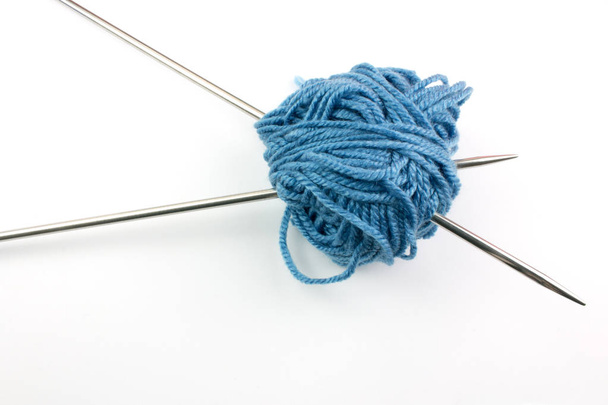 blue yarn ball and knitting needles isolated on white background - Zdjęcie, obraz