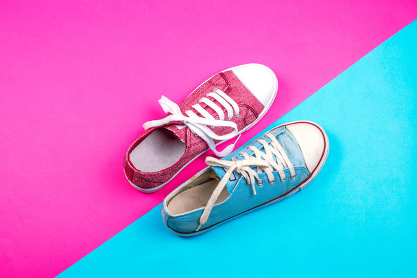 pair of vibrant sneakers on colorful background  - Фото, изображение