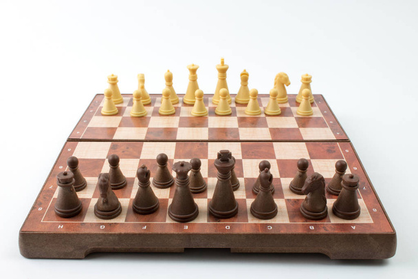 plastic chess board on white background - Фото, изображение