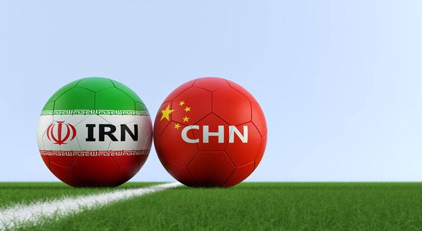 China vs. Iran Soccer Match - Soccer balls in Chinas and Irans national colors on a soccer field. Copy space on the right side - 3D Rendering  - Фото, изображение