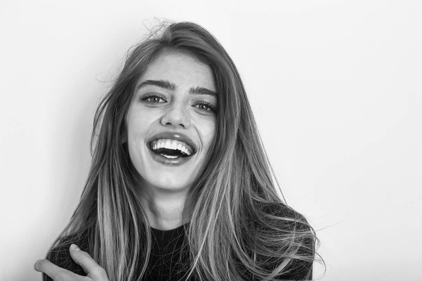 sexy pretty smiling girl with long blond hair in black - Fotoğraf, Görsel