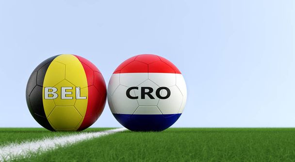 Belgium vs. Croatia Soccer Match - Soccer balls in Belgium and Croatia national colors on a soccer field. Copy space on the right side - 3D rendering  - Foto, Bild