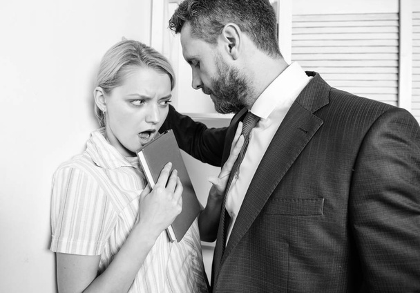 Businessman Sexually Harassing Female Colleague. Sexual harassment between colleagues and flirting in office. Victim of sexual assault and harassment at workplace. - Φωτογραφία, εικόνα