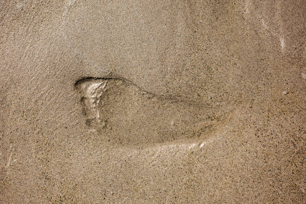 Voetstappen in het zand - Foto, afbeelding