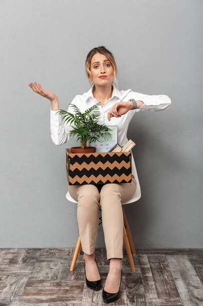 Portrait of caucasian woman holding box with office belongings w - Photo, image