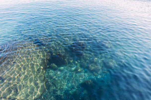 clear transparent sea water on sunny day, barcelona, spain - Photo, image