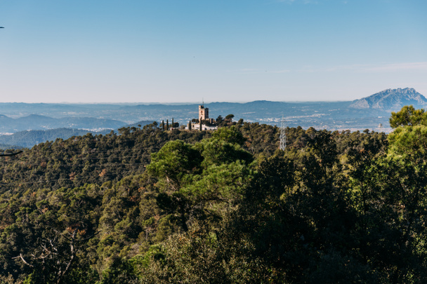scenic view of castle and hills covered with green trees, barcelona, spain - Photo, Image