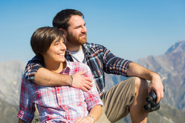 Young Couple at Top of Mountain - Photo, Image