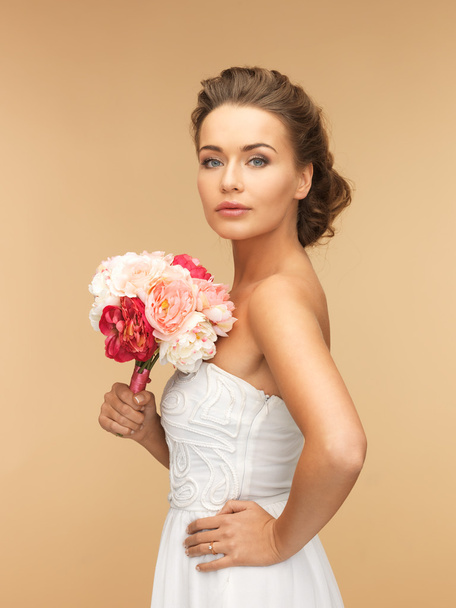 Woman with bouquet of flowers - Photo, image