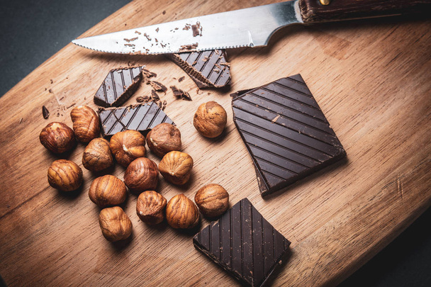 Black chocolate with hazelnuts - Zdjęcie, obraz