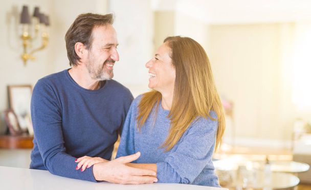 Romantic middle age couple sitting together at home - Photo, Image