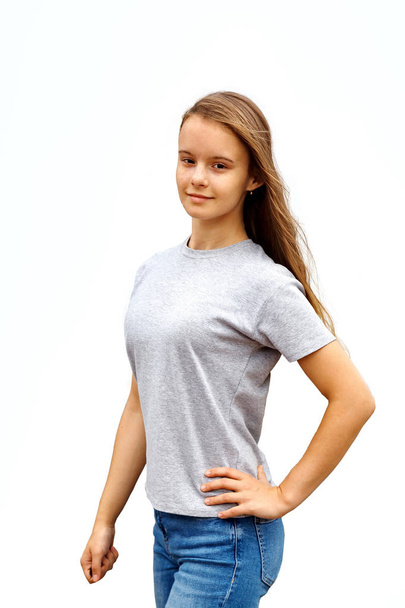 girl in grey t-shirt on white background - Фото, изображение
