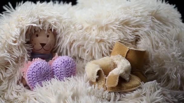 newborn baby wool clothes shoes toy bear hd footage  - Кадри, відео