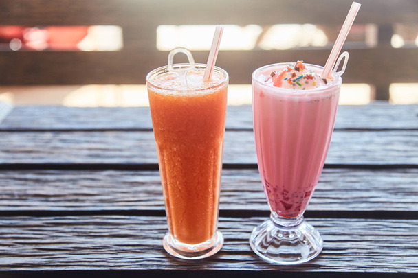 A glass of traditional Indian drink Faluda and fresh papaya juice. - Photo, Image