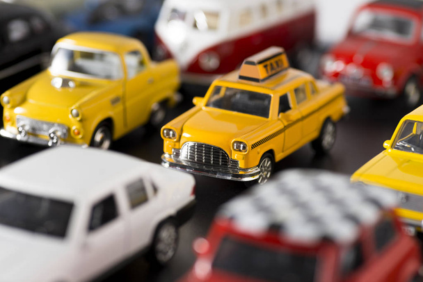 Various some brand toy cars on a black ground, looks like a traf - 写真・画像