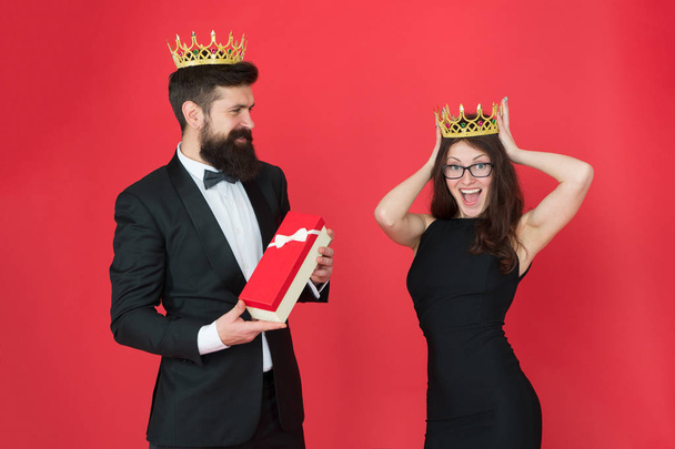 royal couple in love. date. business success. business fashion. anniversary party gift. Formal business couple. man in tuxedo and woman. Bearded man and happy woman in crown. Successful professional - 写真・画像