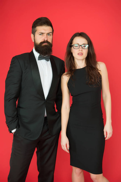 Formal dress code. Official event concept. Man bearded wear tuxedo girl elegant dress. Visiting event or ceremony. Couple classy clothes. Elite event. Main rules picking clothes. Corporate party - Valokuva, kuva