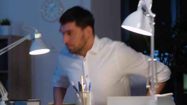 businessman with laptop working at night office - Video, Çekim