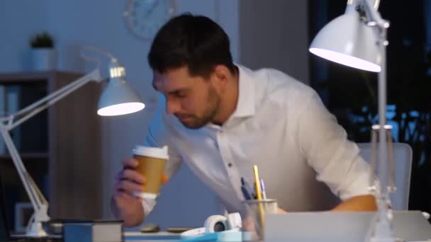 businessman with laptop and headphones at night - Video, Çekim