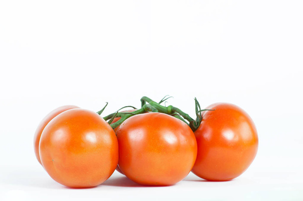 tomatoes on a branch .isolated white background - 写真・画像