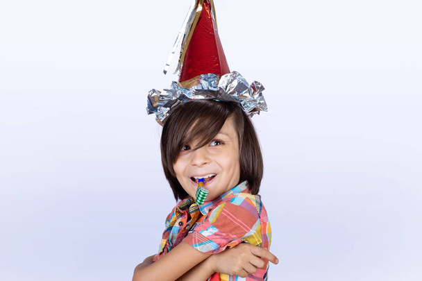Little boy with whistle and party hat. - Foto, immagini