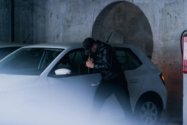 Bandit stealing a car - Фото, зображення