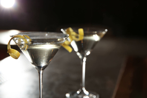 Glasses of lemon drop martini cocktail in bar, closeup. Space for text - Foto, afbeelding
