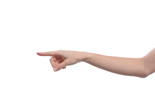 Woman pointing at something on white background, closeup of hand - Fotó, kép