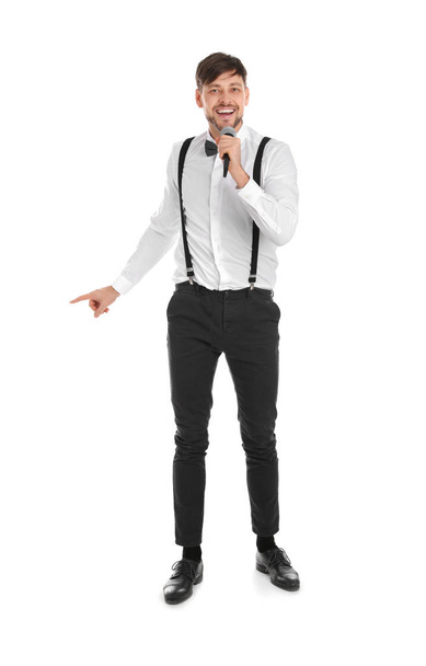 Handsome man in formal clothes singing with microphone on white background - Fotoğraf, Görsel