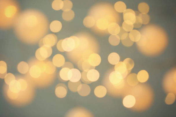 Blurred view of shiny gold lights. Bokeh effect - Fotó, kép