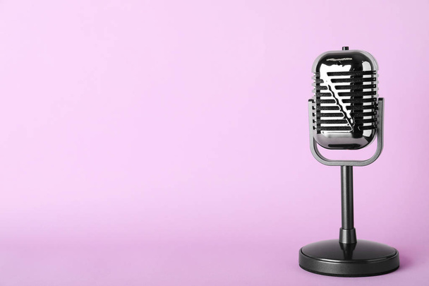 Retro microphone on color background, space for text - Photo, image