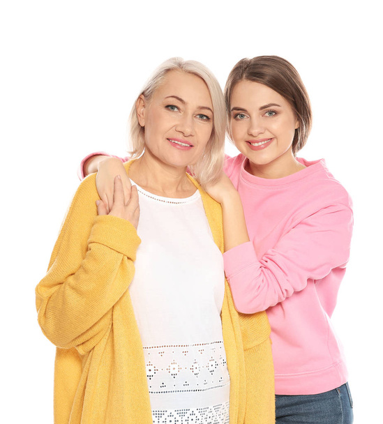 Portrait of mature woman and her daughter isolated on white - Φωτογραφία, εικόνα