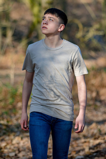 Teenage boy outside on a bright Spring day - Photo, Image