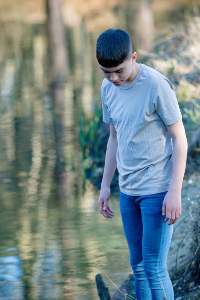 Teenage boy outside on a bright Spring day - Foto, imagen