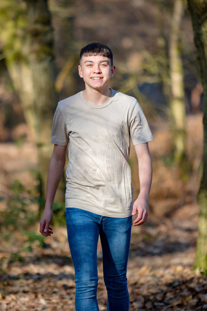 Teenage boy outside on a bright Spring day - Photo, Image