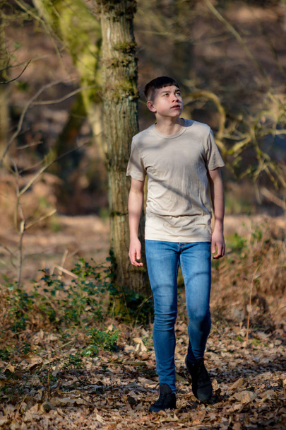 Teenage boy outside on a bright Spring day - Foto, Imagen