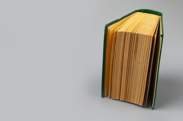 Book in a green cover - Φωτογραφία, εικόνα