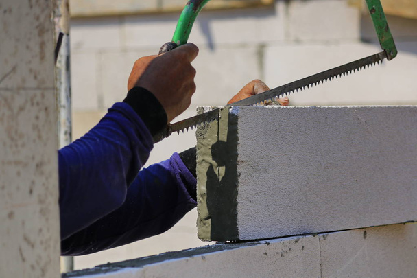 Construction technicians are building brick walls with lightweight bricks. - Photo, Image