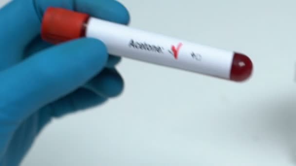 Acetone, doctor holding blood sample in tube close-up, health examination - Video, Çekim
