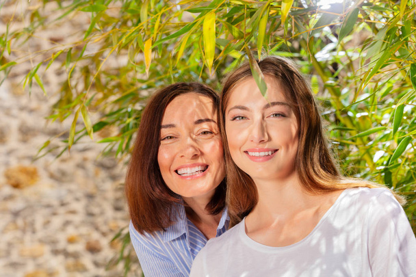 Portrait of happy mother and her adult daughter - Photo, image